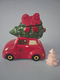 Nostalgische auto met Kerstboom waxmeltbrander