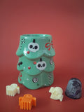 Griezelige kerstboom waxmeltbrander